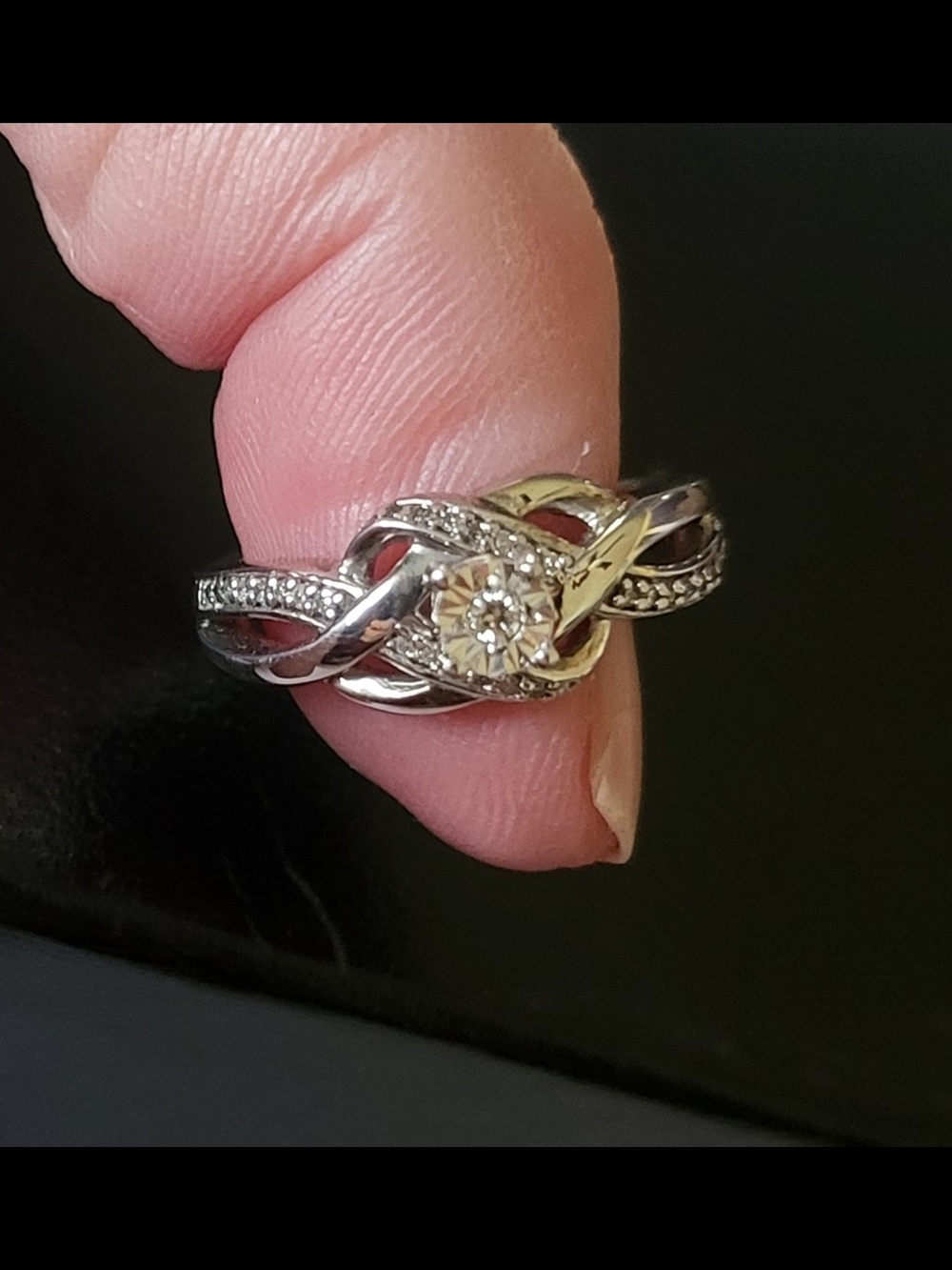 Sterling Silver Knot Ring with Center Diamond Accent.